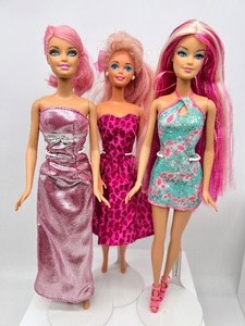lot 164 image: Pretty in Pink  Barbie Trio including Hairtastic & Long Long Hair Streaks