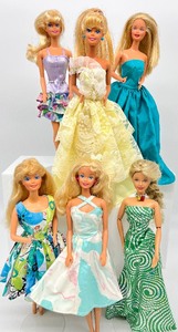 lot 175 image: Lot of 6 Barbies in Blues and Yellows