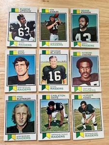 lot 43 image: 1973 Topps Football Oakland Raiders Lot of 9 Cards - Fred Biletnikoft, Eugene Upshaw, George Blanda, and More