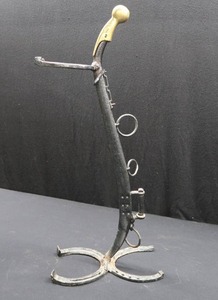 lot 89 image: RUSTIC HORSE THEME STAND MADE OF VINTAGE HAINES AND HORSESHOES