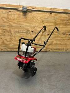 lot 2 image: HONDA 9 in. 25 cc 4-Cycle Middle Tine Forward-Rotating Gas Mini Tiller-Cultivator