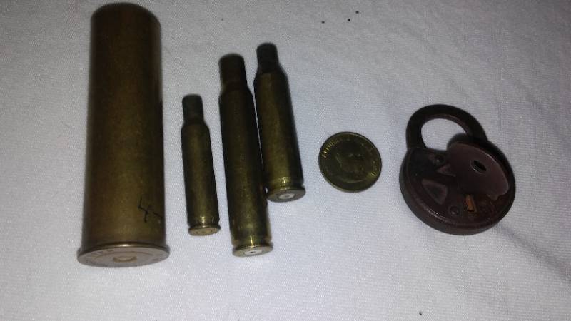 lot 548 image: Antique lock and Winchester casings.