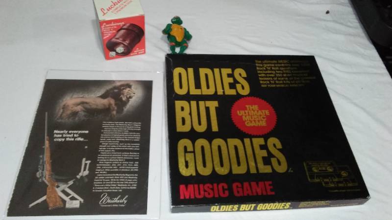 lot 587 image: Lucki dice cup, TMNT- Michelangelo, oldies game, incomplete.