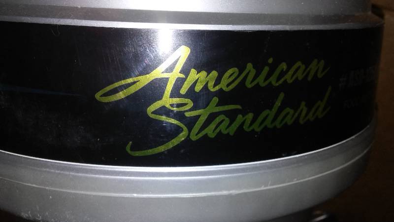 lot 724 image: Garbage Disposal. American Standard.