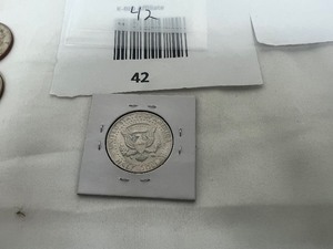 lot 42 image: KENNEDY HALF DOLLAR ERROR COIN