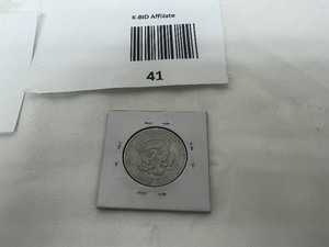lot 41 image: KENNEDY HALF DOLLAR ERROR COIN