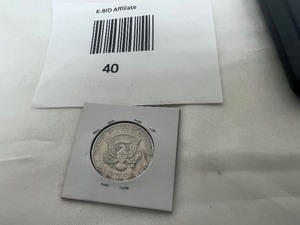 lot 40 image: KENNEDY HALF DOLLAR ERROR COIN