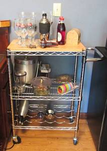 lot 24 image: Man Cave Bar Extravaganza  Mini-fridge, microwave, chrome serving prep cart with tools, glasses, and supply goodies for a well stocked bar