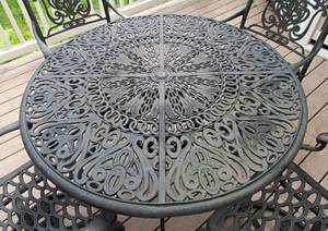 lot 42 image: Patio Set  wrought iron outdoor furniture, cushions and resin deck box  bundle