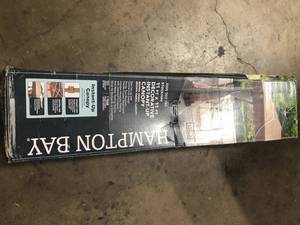 Hampton Bay Stockton 11 ft. x 11 ft. Brown Outdoor Patio Pop-Up Canopy with Netting    Customer Returns See Pictures