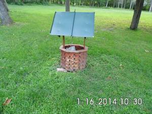 lot 27 image: Wooden wishing well lawn ornament