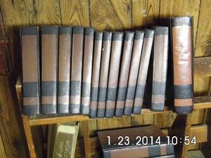 lot 208 image: Bookshelf filled with encyclopedias