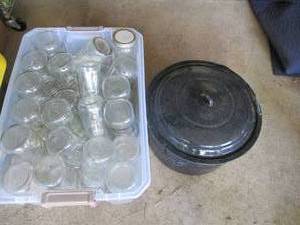 lot 165 image: Covered storage tote full of Canning jars