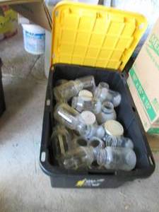 lot 167 image: 27-gallon covered tote full of Canning jars