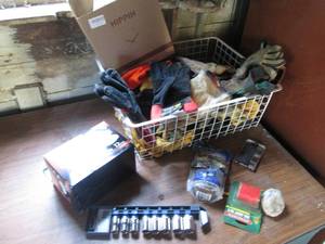 lot 41 image: Wire basket full of assorted gloves, more