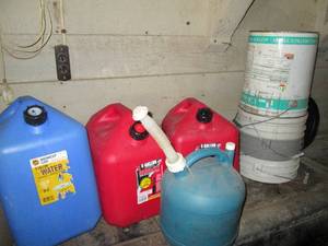 lot 54 image: 6-gallon kerosene can, 5-gallon gas can plus