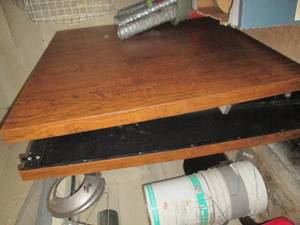 lot 57 image: Super huge 12 ft folding table on wheels