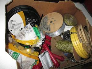 lot 59 image: Fruit box containing electric fencing parts
