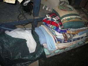 lot 98 image: Large stack of quilts blankets plus