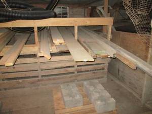 lot 389 image: Lot of lumber and concrete post bases