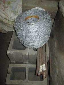 lot 399 image: Roll of barbed wire and rebar