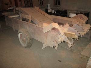 lot 409 image: Manure spreader with a few bonus items on top
