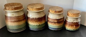 lot 37 image: Set of Four Pretty Pottery Canisters with Cork Lids