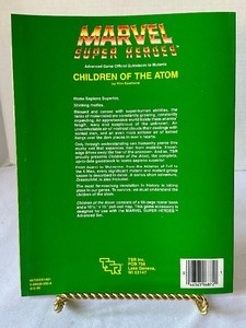 lot 225 image: Book Marvel Super Heroes Children of the Atom by Kim Eastland