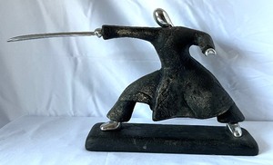 lot 62 image: Pair of Samuri Sculptures with Chrome Swords