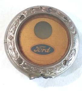 lot 209 image: Antique FORD radiator gauge.