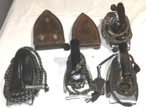lot 339 image: Electric irons and stands.