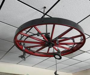 lot 31 image: Large 48 inch wood spoked wheel hanging light