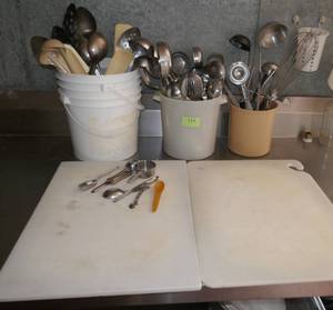lot 114 image: Lot of utensils - lots of large spoons, spatulas, ice cream scoops, whisks etc and 2 cutting boards