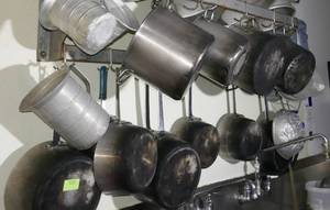 lot 123 image: Wall full of pots and pans