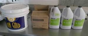 lot 138 image: Three 1 gallon bottles of Lime-a-way, Sun Gold cleaner, 2 bags of cleaner - all New Full