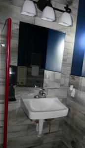 lot 162 image: Mirror, Sink, Light fixture, soap dispenser - Mens bathroom