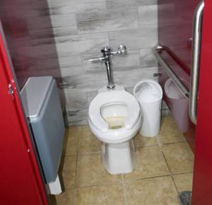 lot 167 image: Toilets and toilet paper dispensers- womens bathroom