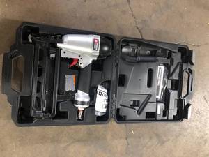 lot 28 image: Porter-Cable Pneumatic 16-Gauge 2-12 in. Nailer Kit  Customer Returns See Pictures