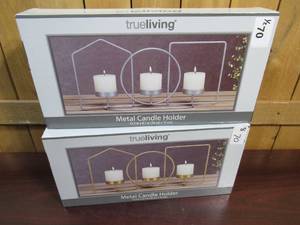 lot 70 image: Two Metal Candle Holders - Silver and Gold