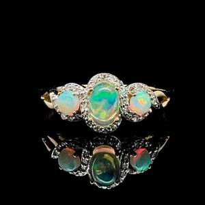 Shimmering White Opal Three-Stone Diamond Halo Ring in 14k Yellow Gold