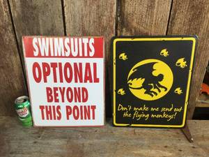 lot 102 image: 2 Metal Signs - Swimsuits - Flying Monkeys