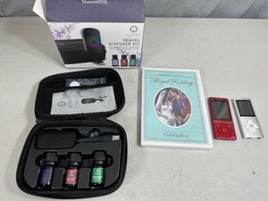 lot 51 image: Travel Oil Diffuser Set, Mp3 Players, Royal Wedding DVD