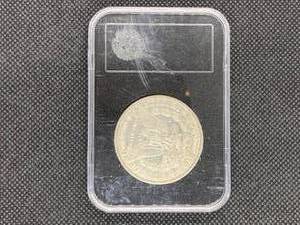 1884 Morgan Silver Dollar in holder