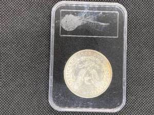 1887 Brilliant Uncirculated Morgan Silver Dollar in holder