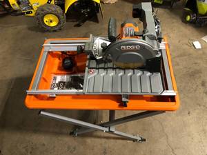 lot 9 image: RIDGID 9 Amp 7 in. Blade Corded Wet Tile Saw with Stand  Customer Returns See Pictures