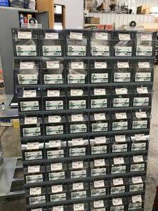 lot 31 image: 66 BIN CABINET WITH ASSORTED ITEMS