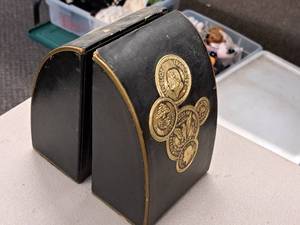 lot 382 image: Lot of (2) 7 Coin theme Book Ends