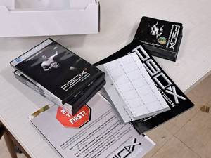 lot 14 image: Lot of (2 Boxes) P90X Extreme Home Fitness Fitness Routine Videos