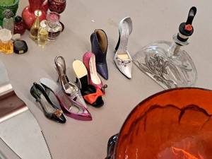 lot 292 image: Lot of (9) Assorted Home Dcor - Womens Shoes, Decanter, Pie Server