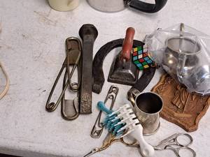 lot 438 image: Lot of  Vintage Household Collectibles - Large Safey Pins, Iron, Spike, Mug, Horseshoe, Rubiks Cube, Mug, Brushes, Scissors